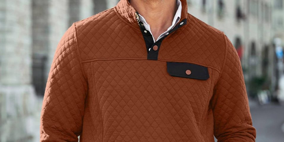 A man wearing a brown jacket