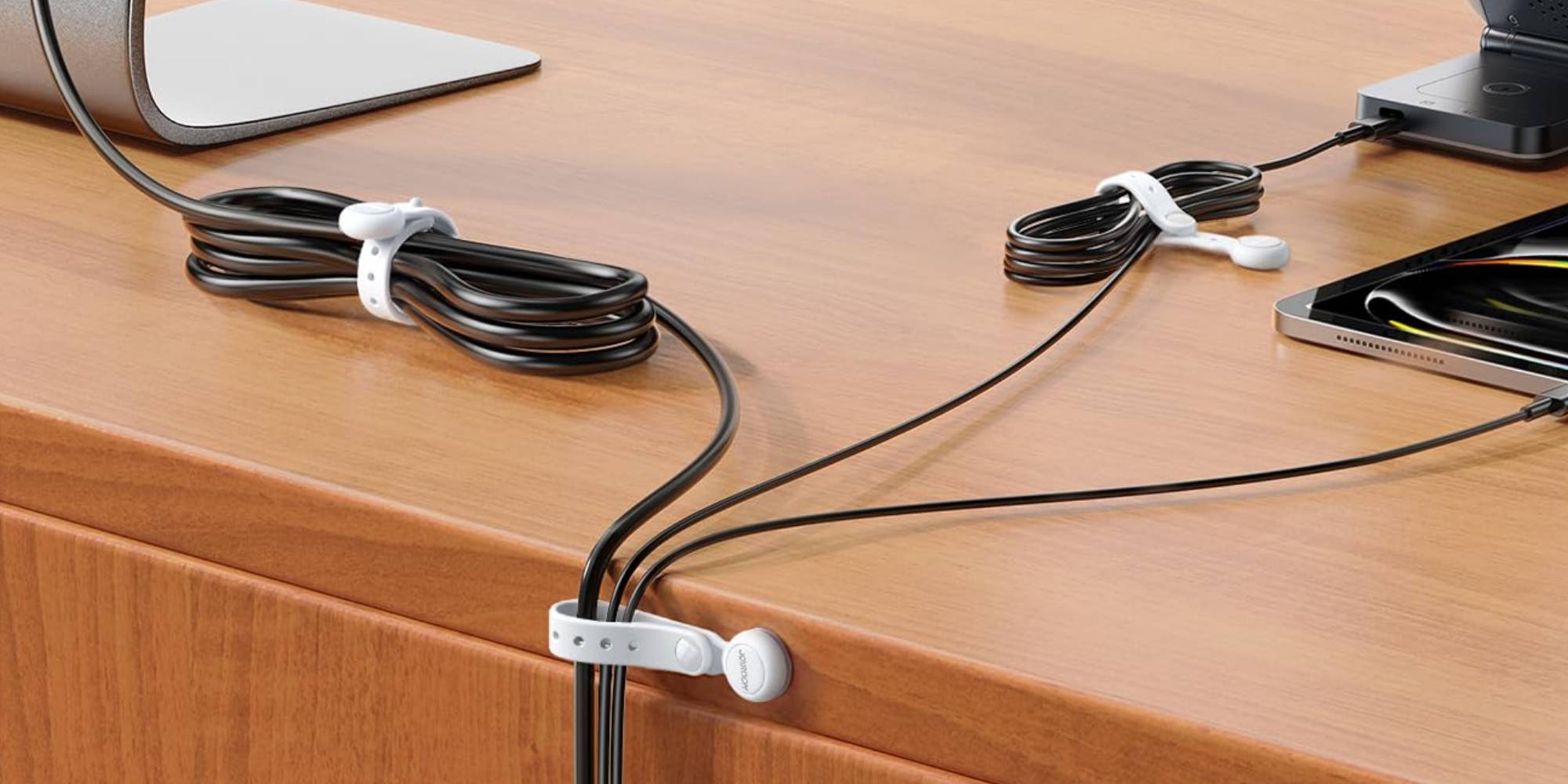 A black wires tied together on a table