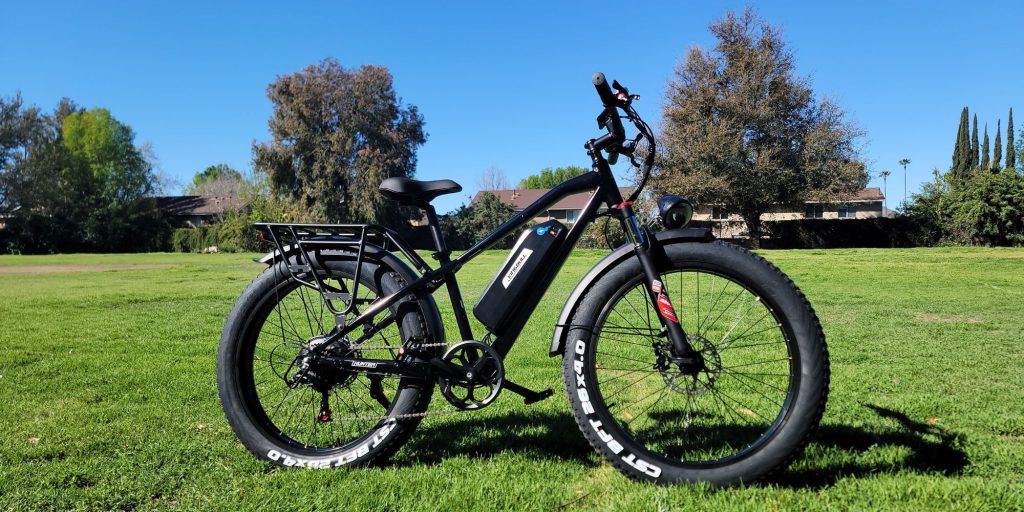 A black bike on grass