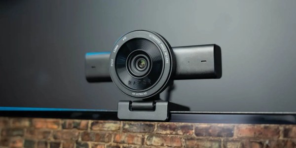 A black camera on a black surface