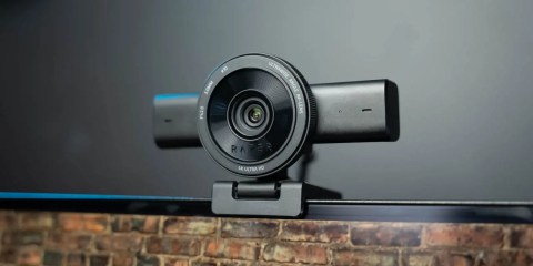 A black camera on a black surface