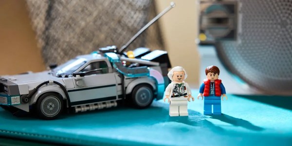 A toy car and two lego figures