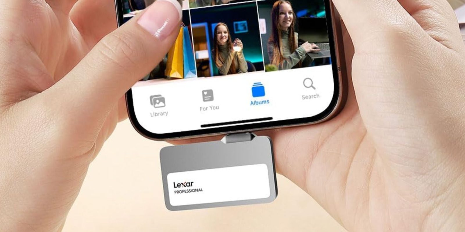 A hand holding a phone with a card