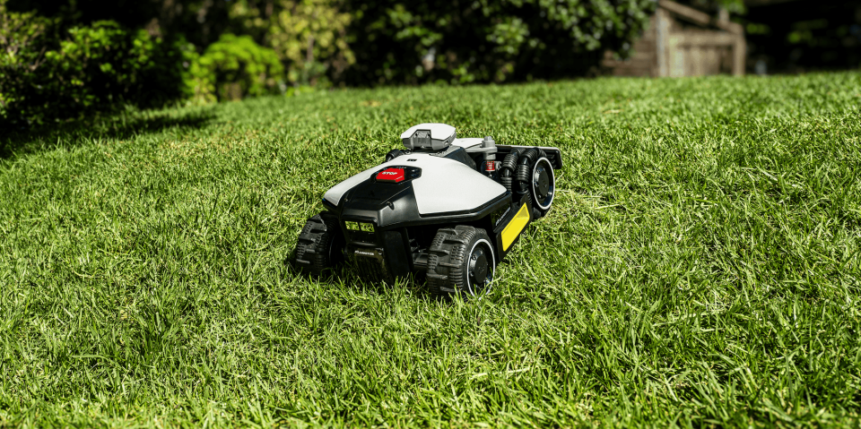 A toy robot in the grass