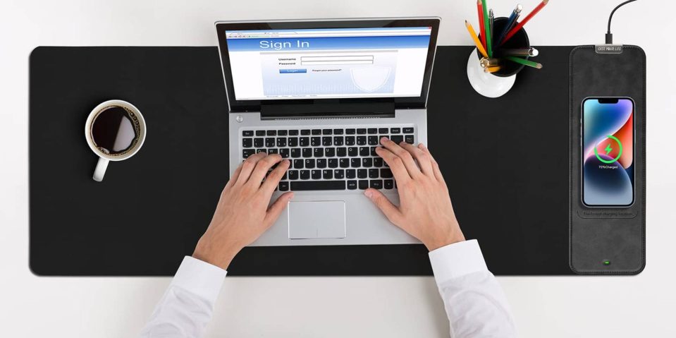 A person typing on a laptop