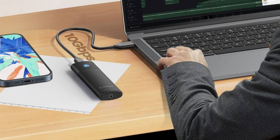 A hand on a laptop