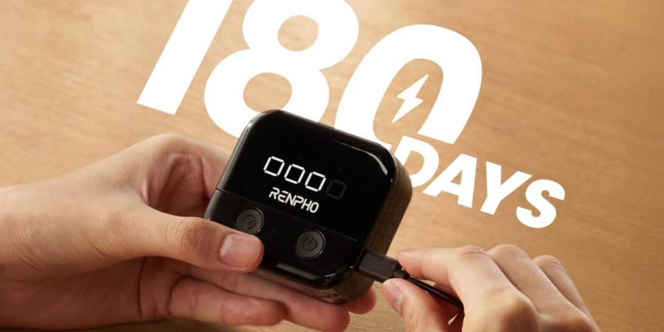 A person holding a black device