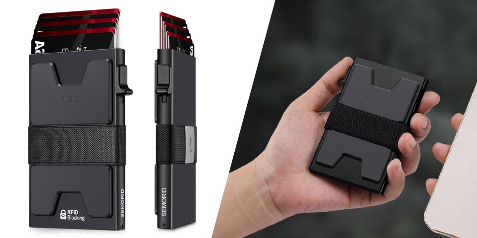 A hand holding a black card holder