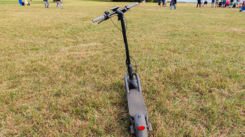A scooter in a grassy field
