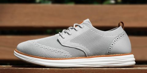 A grey shoe on a bench