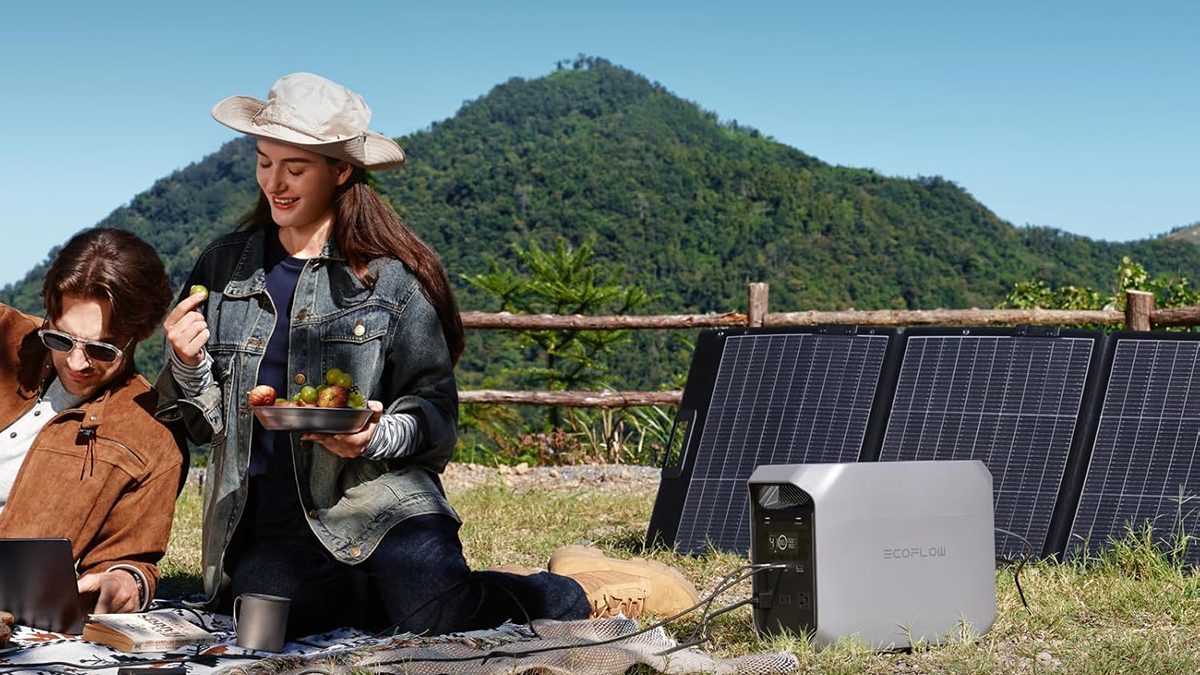 A woman holding a bowl of fruit