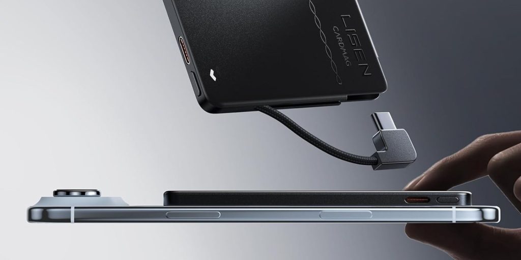 A black rectangular device with a cable attached to it