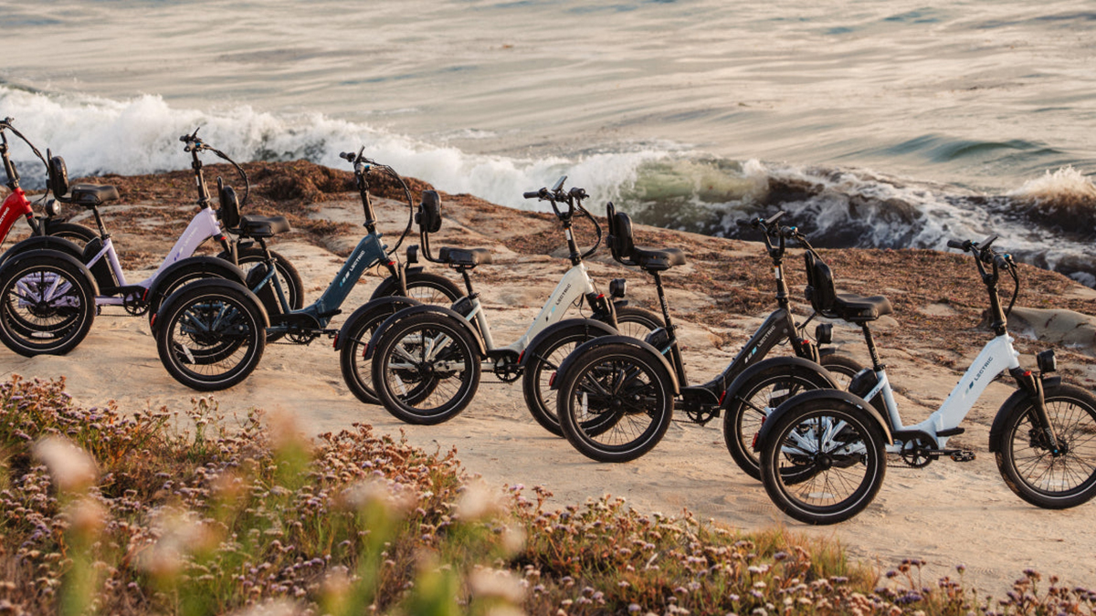 A group of bikes parked on a beach