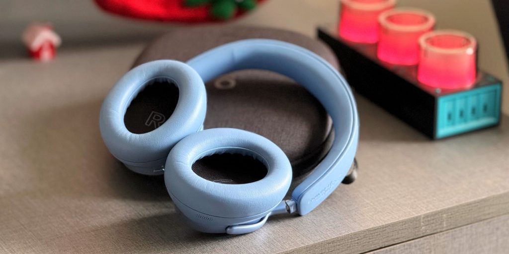 A pair of blue headphones on a table