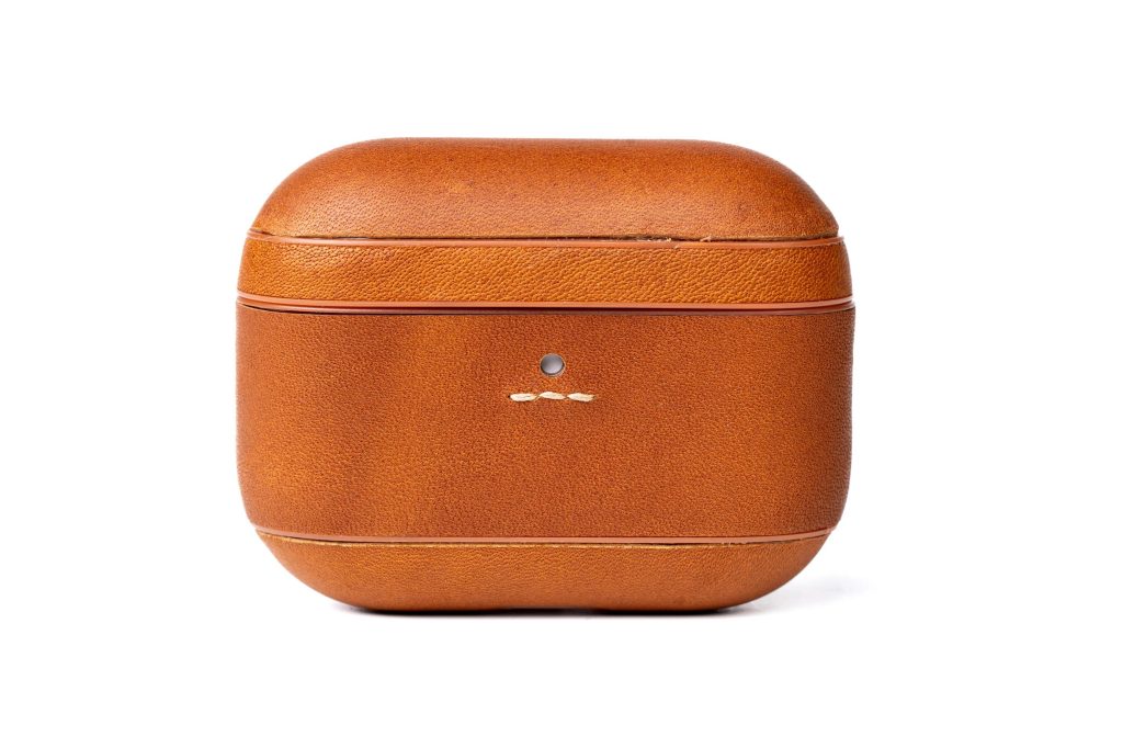 A brown leather case with a white background