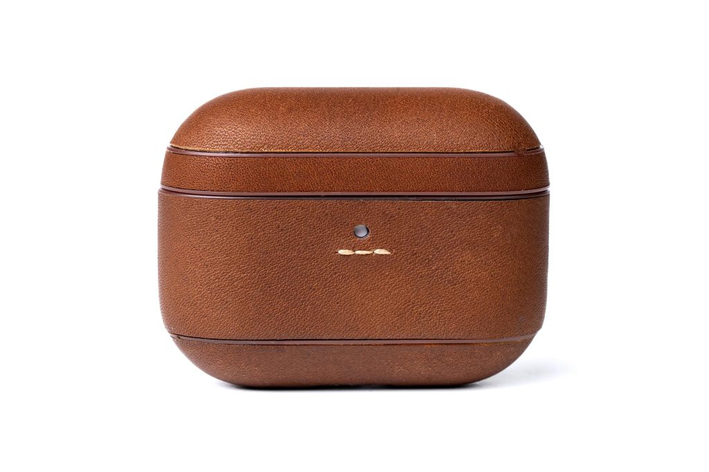 A brown leather case with a white background