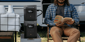 A man sitting in a chair reading a book
