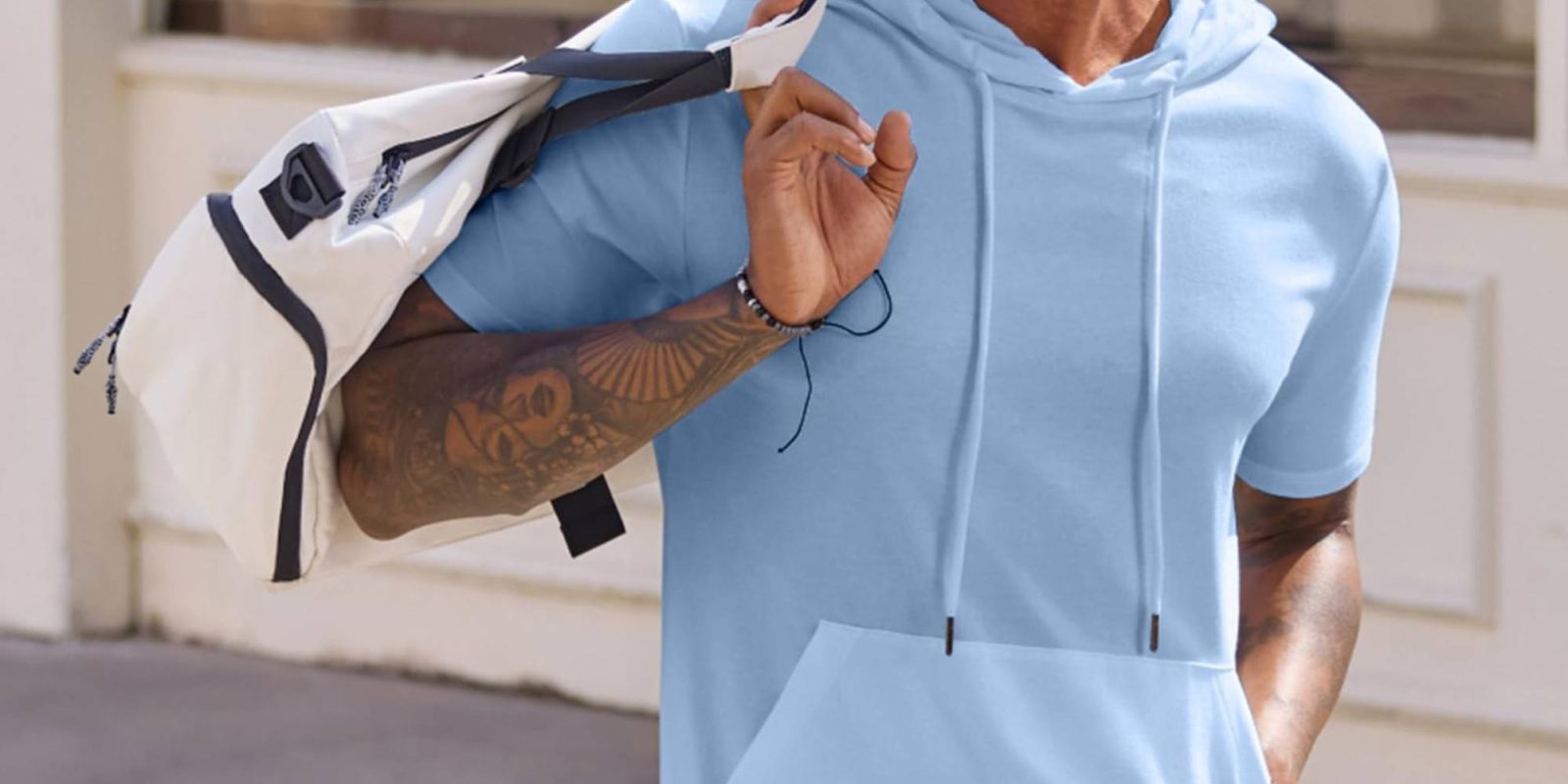 A person wearing a light blue hoodie