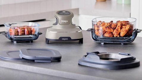 A machine with chicken wings in a bowl