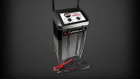 A black and silver battery charger