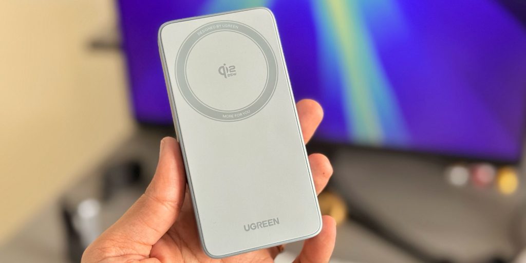 A hand holding a device