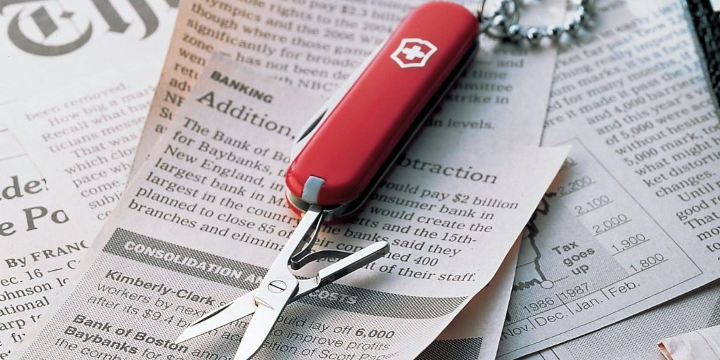 A pocket knife on a newspaper