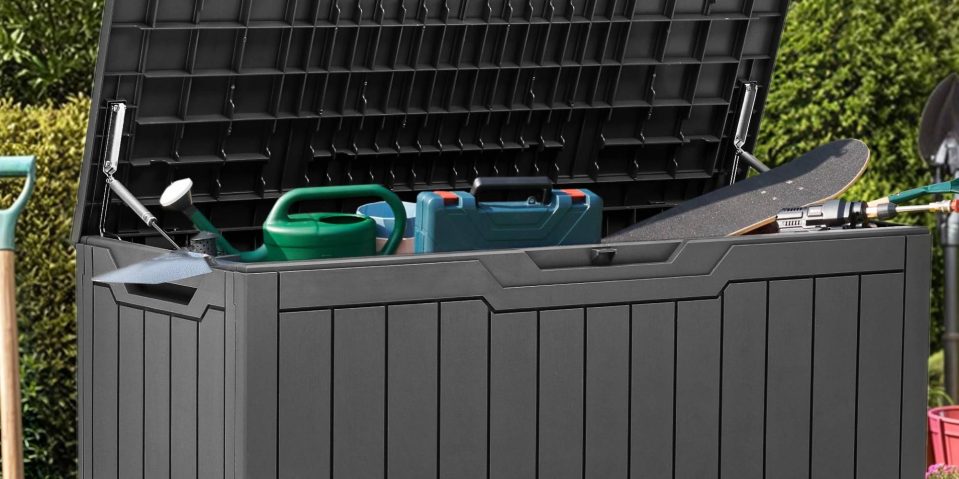 A container with a green watering can and a green watering can in it