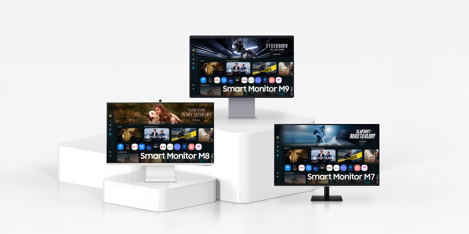 A group of monitors on a white surface