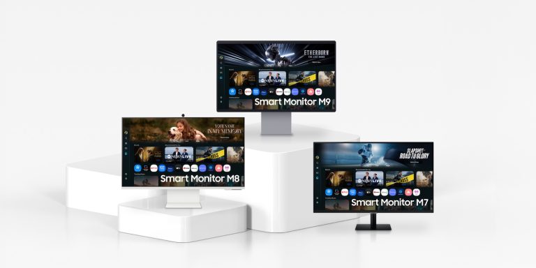 A group of monitors on a white surface