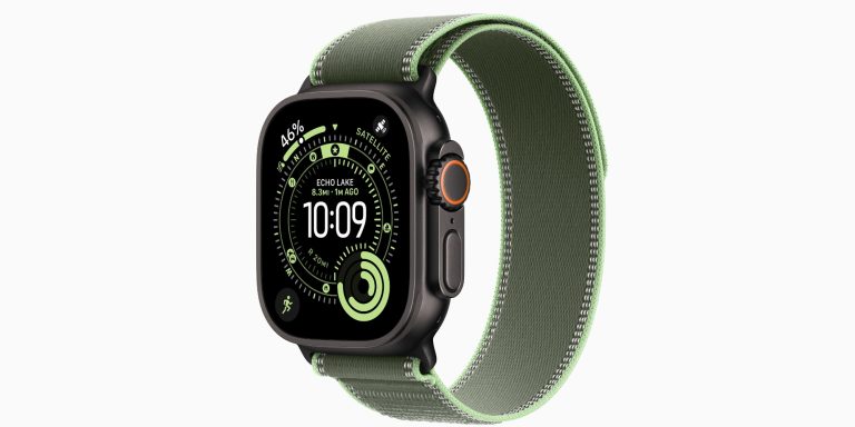 A smart watch with a green band