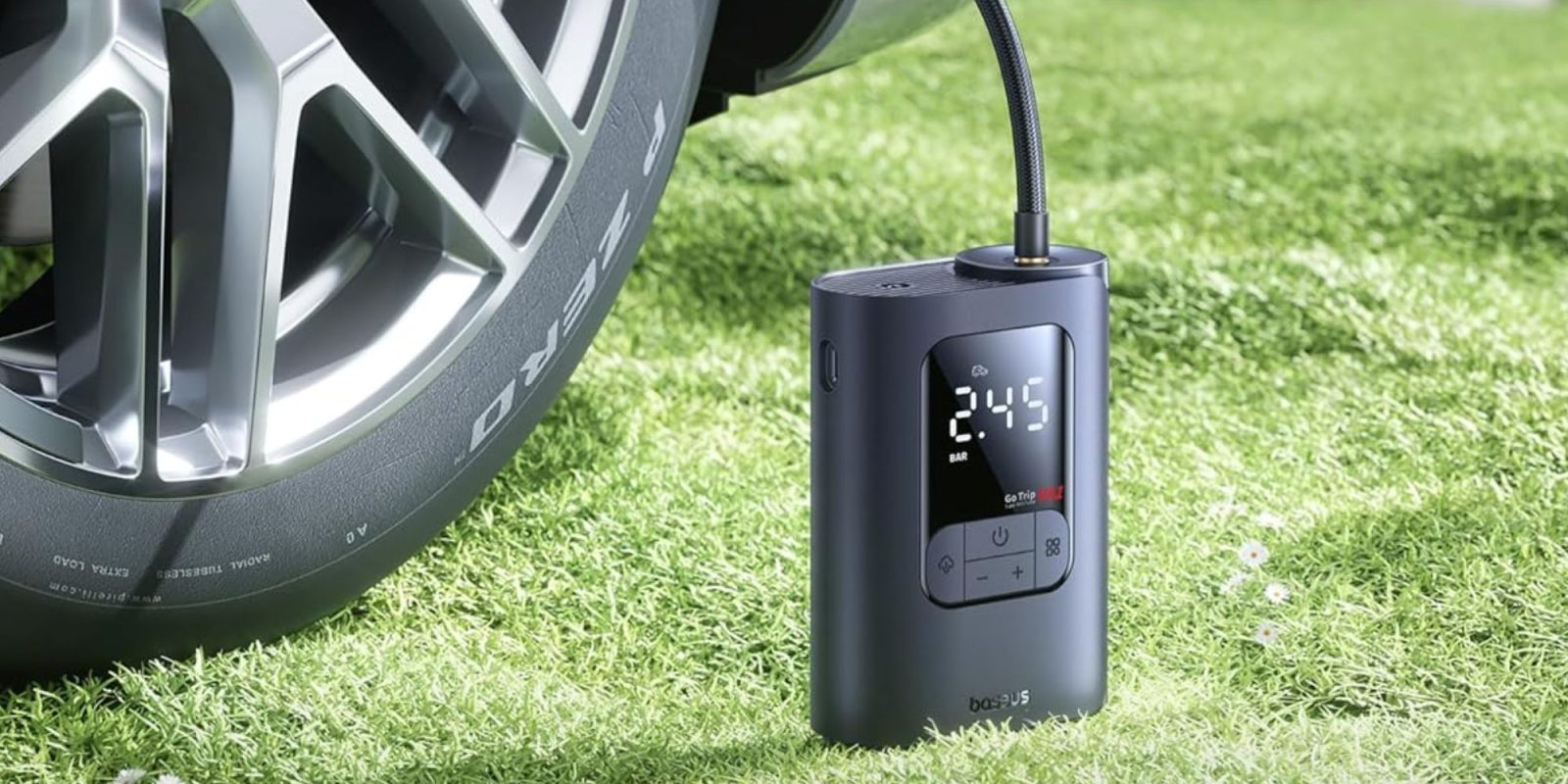 Image showing Baseus' tire inflator attached to a car's tire.
