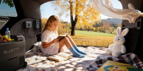 A girl reading a book in a car