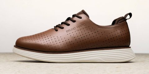 A brown shoe with white sole