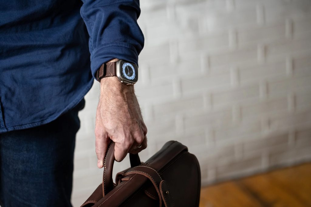 A man holding a brown bag