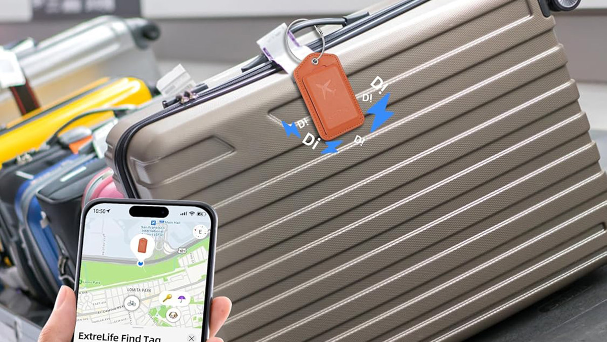 A hand holding a phone and a luggage tag