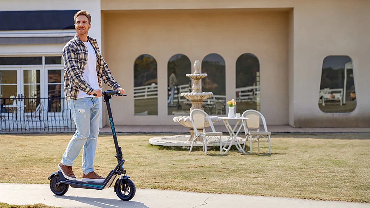 A man riding a scooter