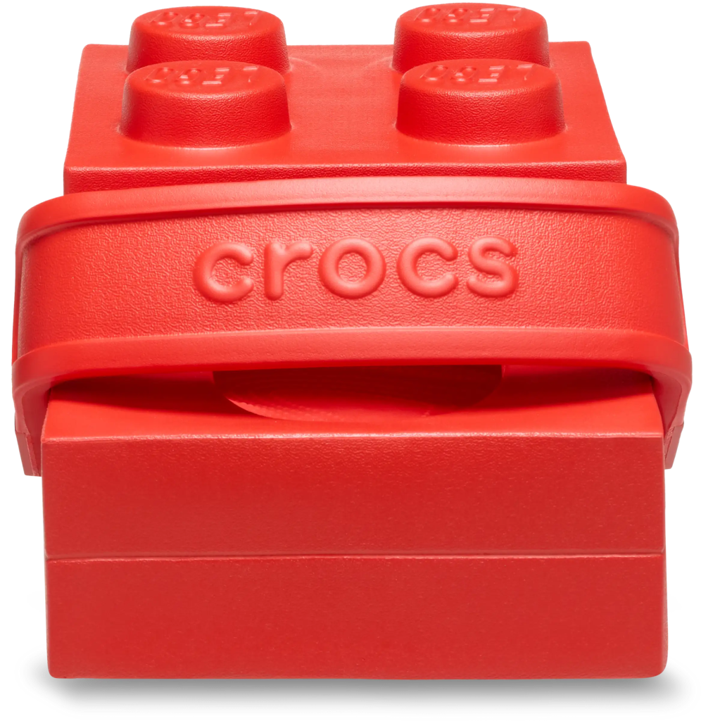 A red toy block with a black background