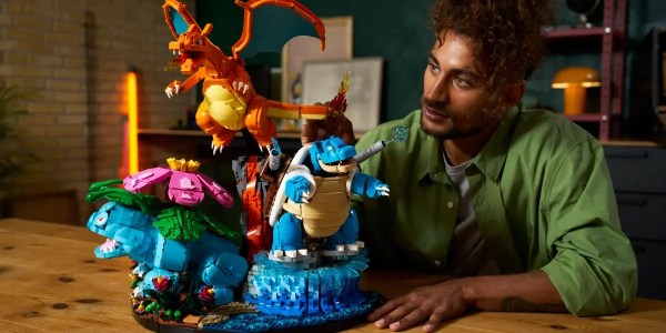 A man looking at a toy