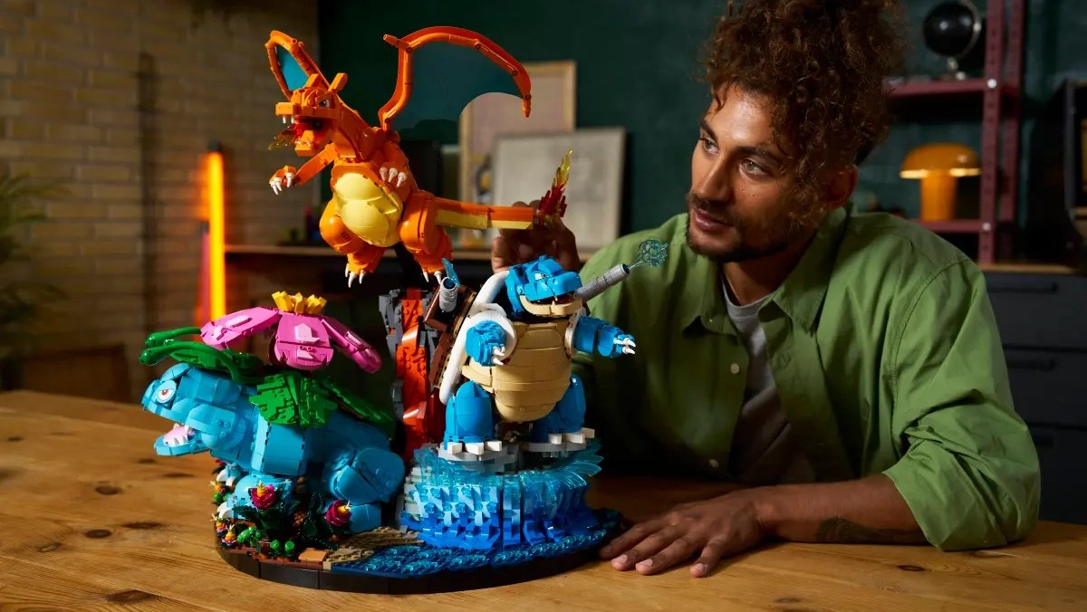 A man looking at a toy