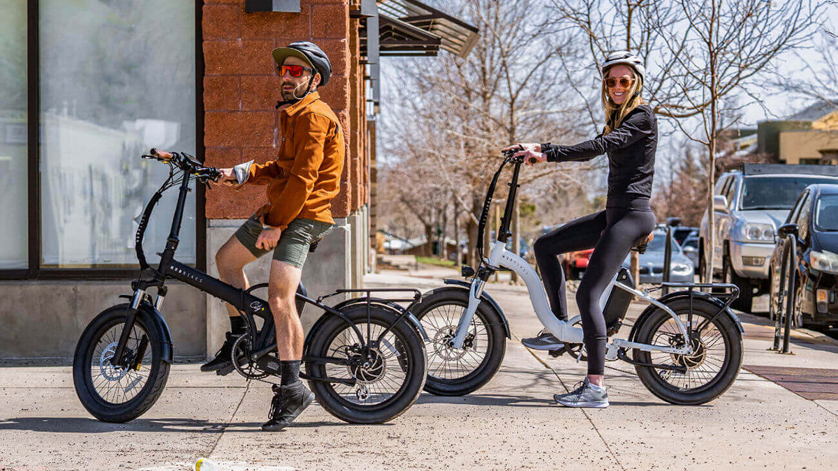 A man and woman riding bicycles