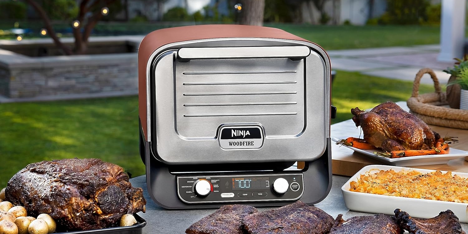 A grill with meat on a table