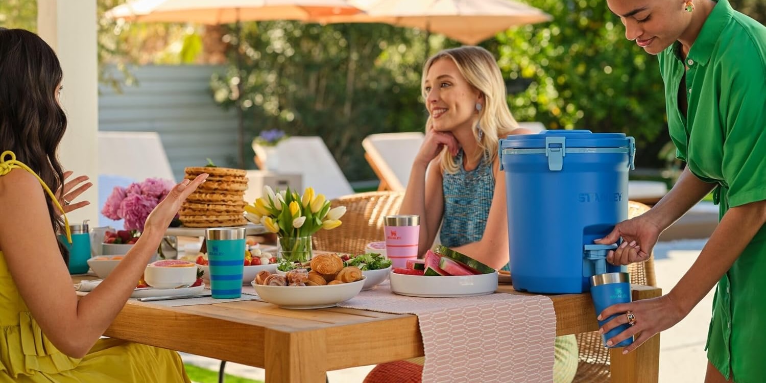 A woman sitting at a table with food on it