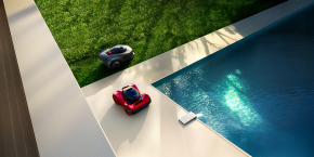 A lawnmower next to a pool