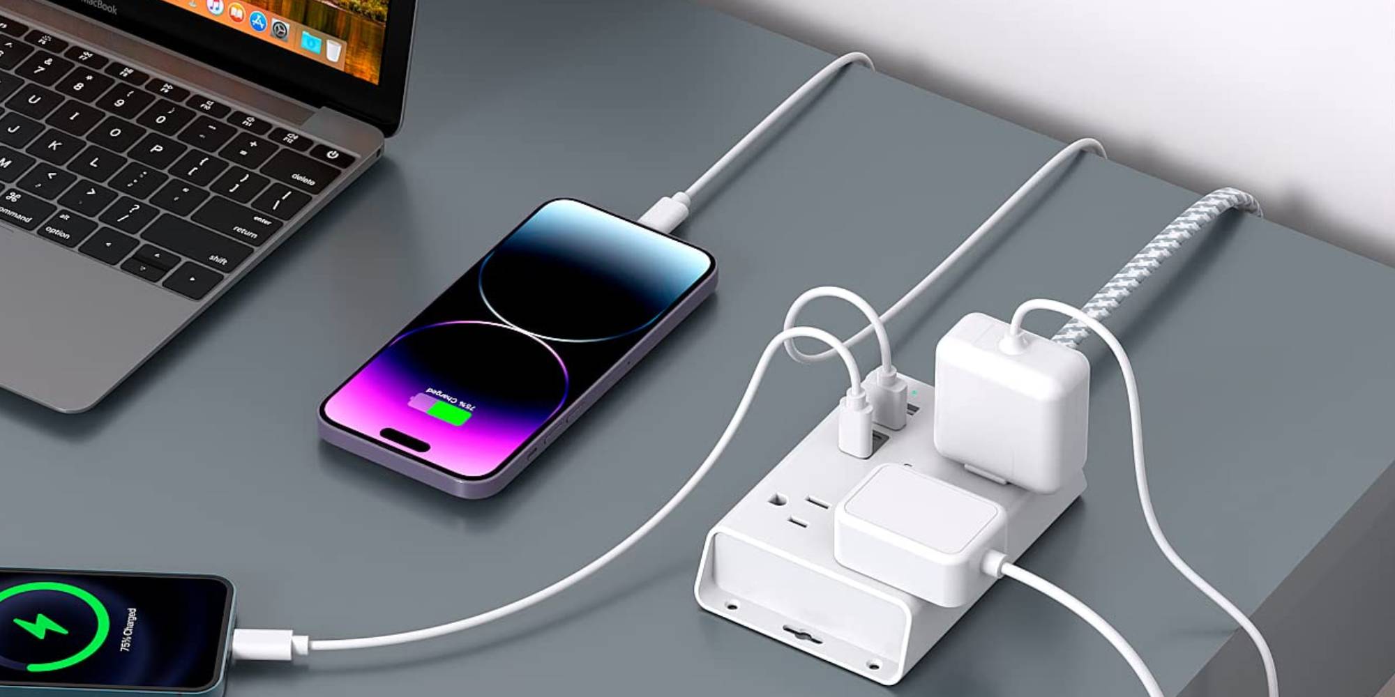 A cell phone charging on a power strip