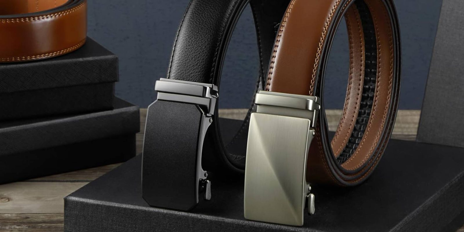 A pair of belts on a black box