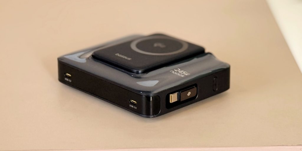 A black electronic device with a square button