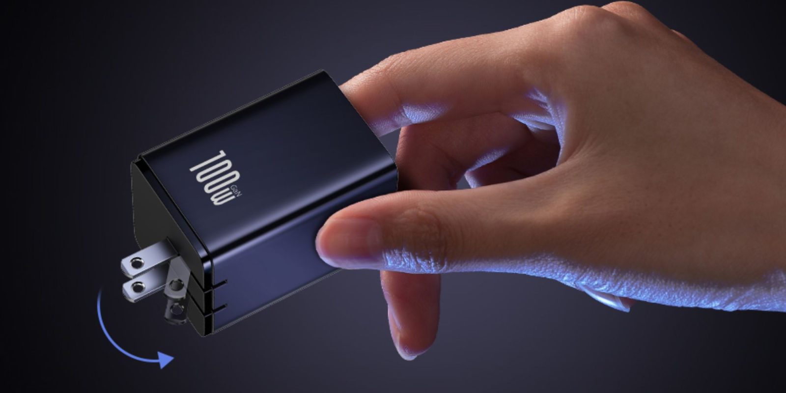 A hand holding a black rectangular object