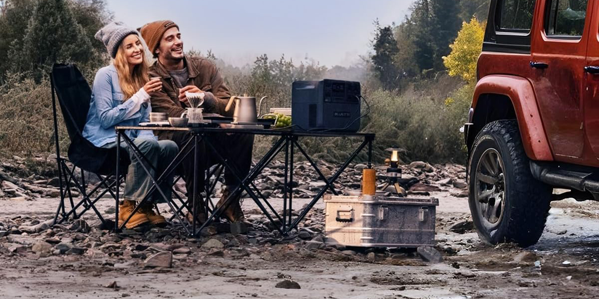 A man sitting at a table with a man in a hat