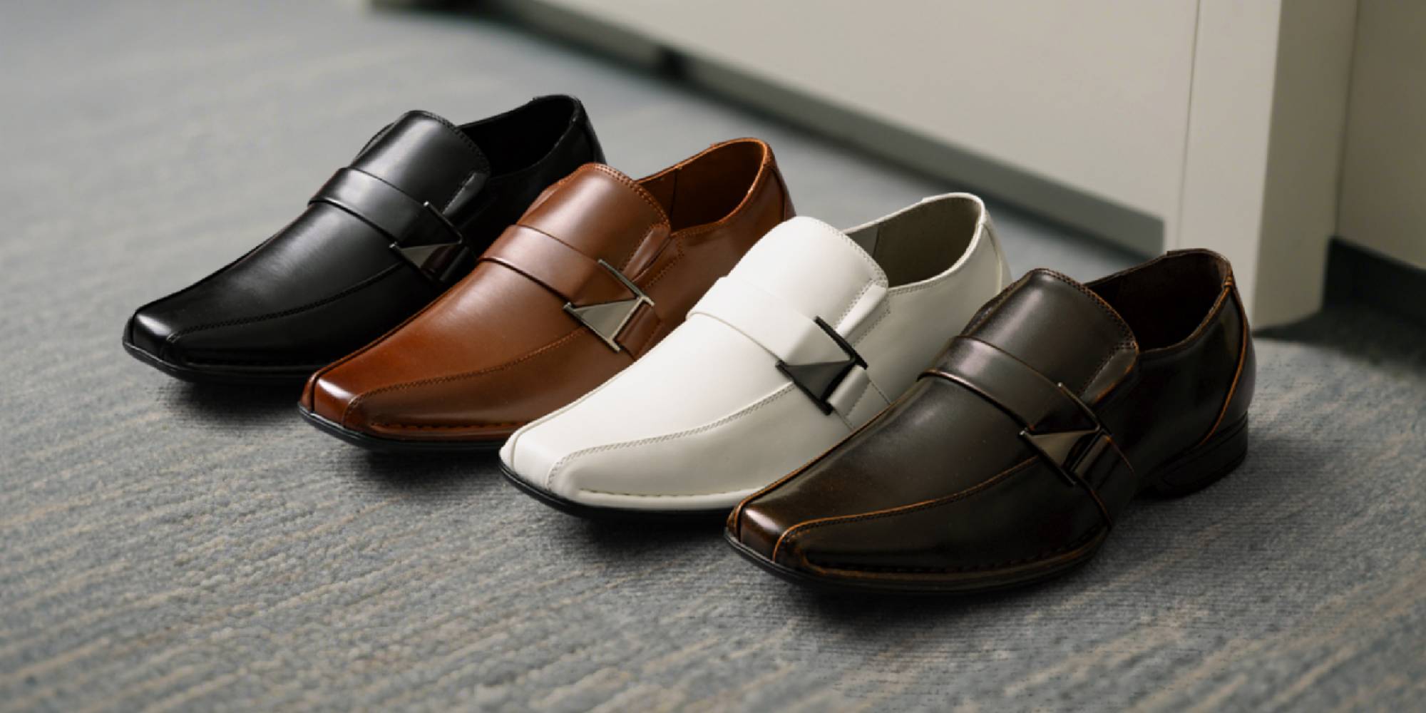 A group of shoes on carpet