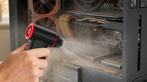 A person spraying dust on a machine